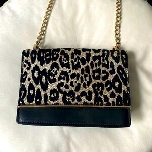 Brand new black & gold leopard print clutch.